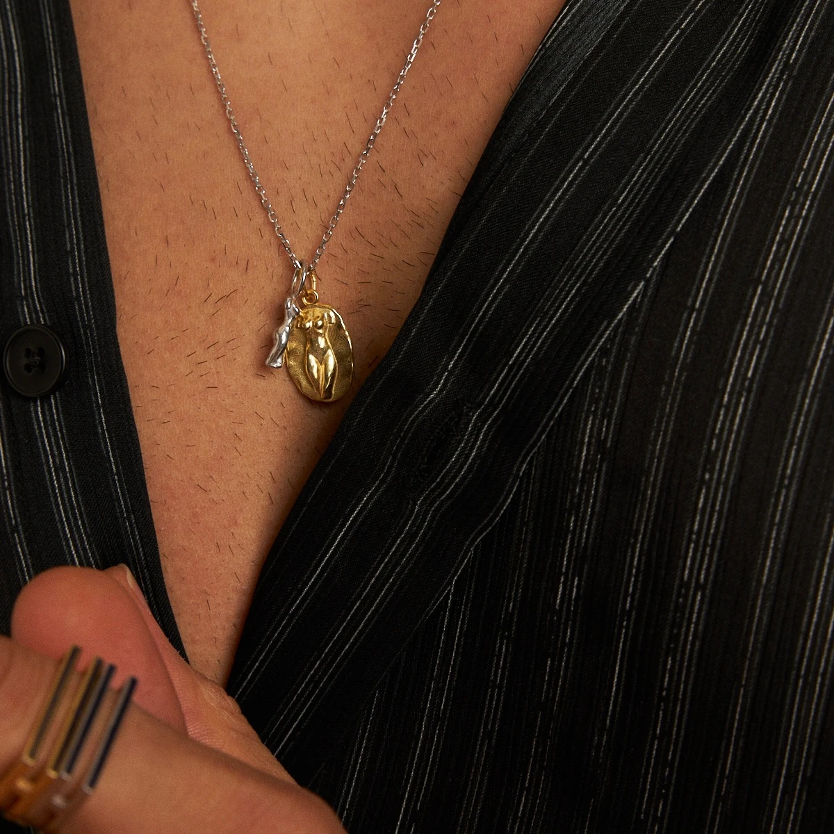 silhouette x statue of a lady necklace